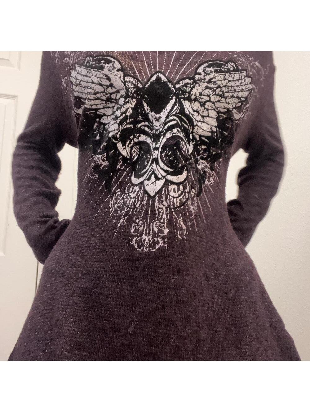 off the shoulder top with skull and wings design